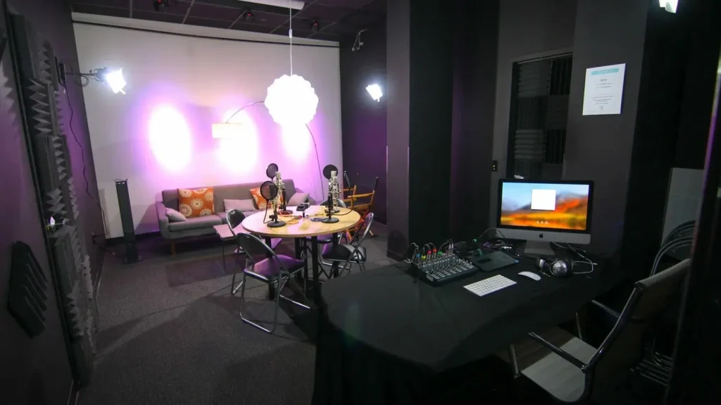 Podcast Studio Lighting Setup – A modern podcast studio with soft LED lights and a professional microphone.