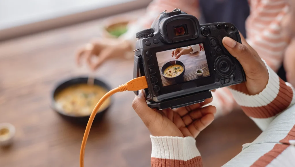 Professional food photo camera setup on a table with styled dishes