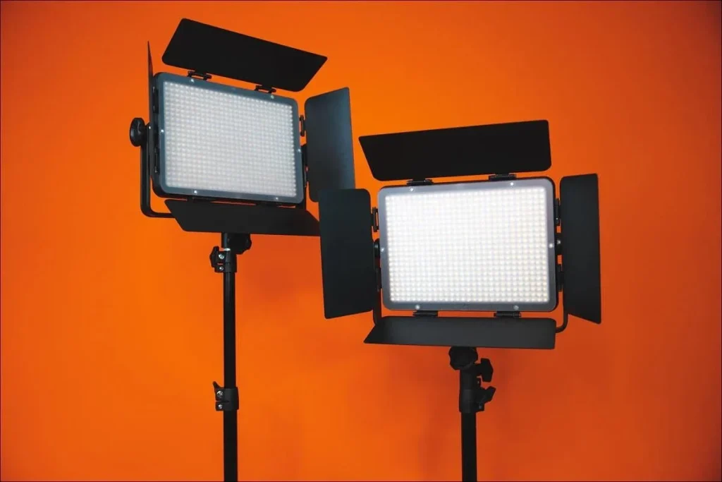 Different types of studio lights arranged in a photography studio, showing key, fill, and back lighting roles
