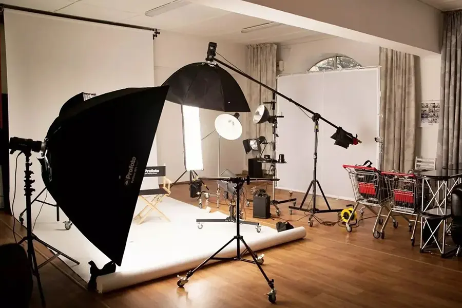 Professional photography studio equipment list with studio lights, softboxes, and stands