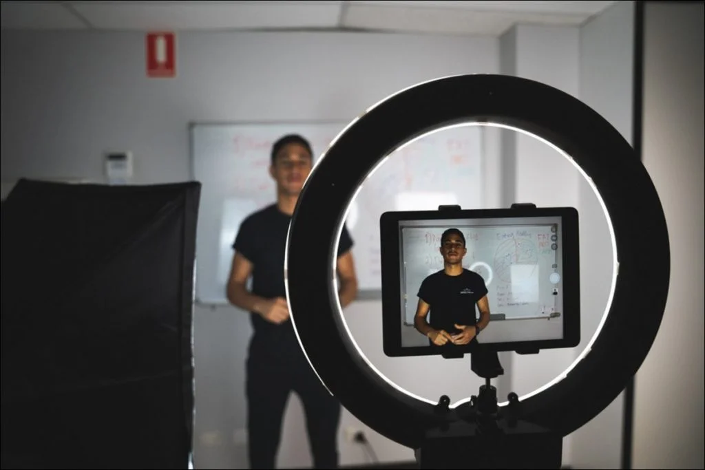 Professional lighting comparison setup showing ring light vs softbox effect on subject depth and background softness